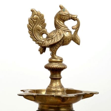 Long Brass Oil Lamp with Peacock Design.