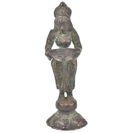 Bronze Lady Holding A Diya In Her Hand Is On A Raised Platform With Patina
