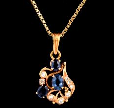 Artistic 18 k Gold Pendant With Blue Sapphire Stones and Diamonds