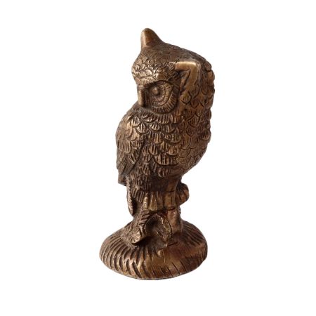 Brass Owl  Statue Perched On Top Of A Wooden Branch