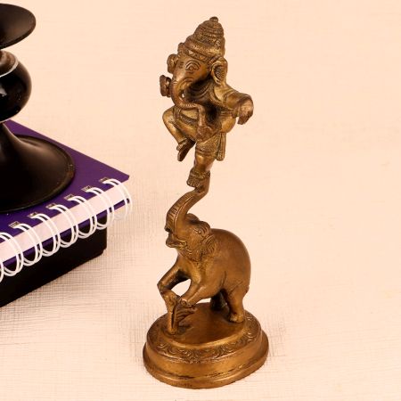 Brass Statue of Lord Ganesha Standing on Elephant Trunk