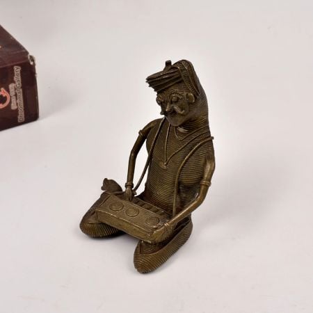 Handcrafted Tribal Art Brass Statue of Man Playing Instrument