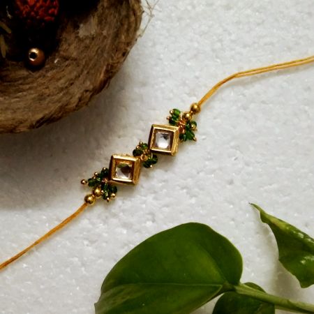 Traditional Rakhi with Acrylic, Kundan Beads, Wooden, Metal