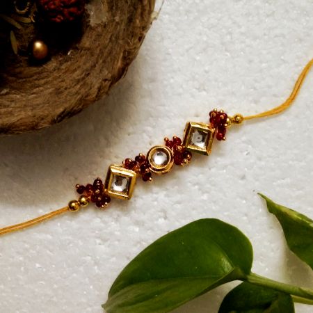 Traditional Rakhi with Wooden, Acrylic, Kundan Beads, Metal