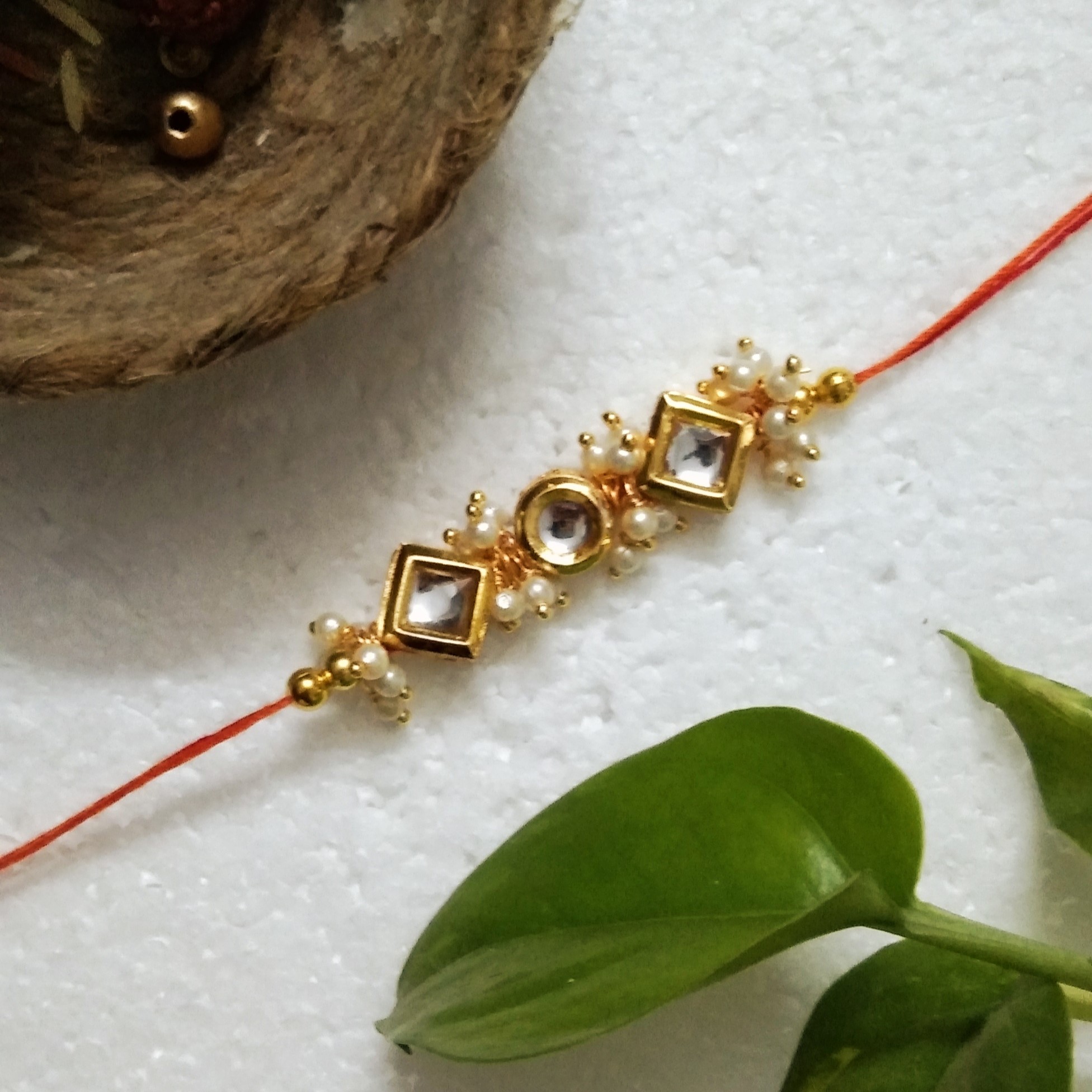 Traditional Rakhi with Wooden, Kundan Beads, Acrylic, Metal