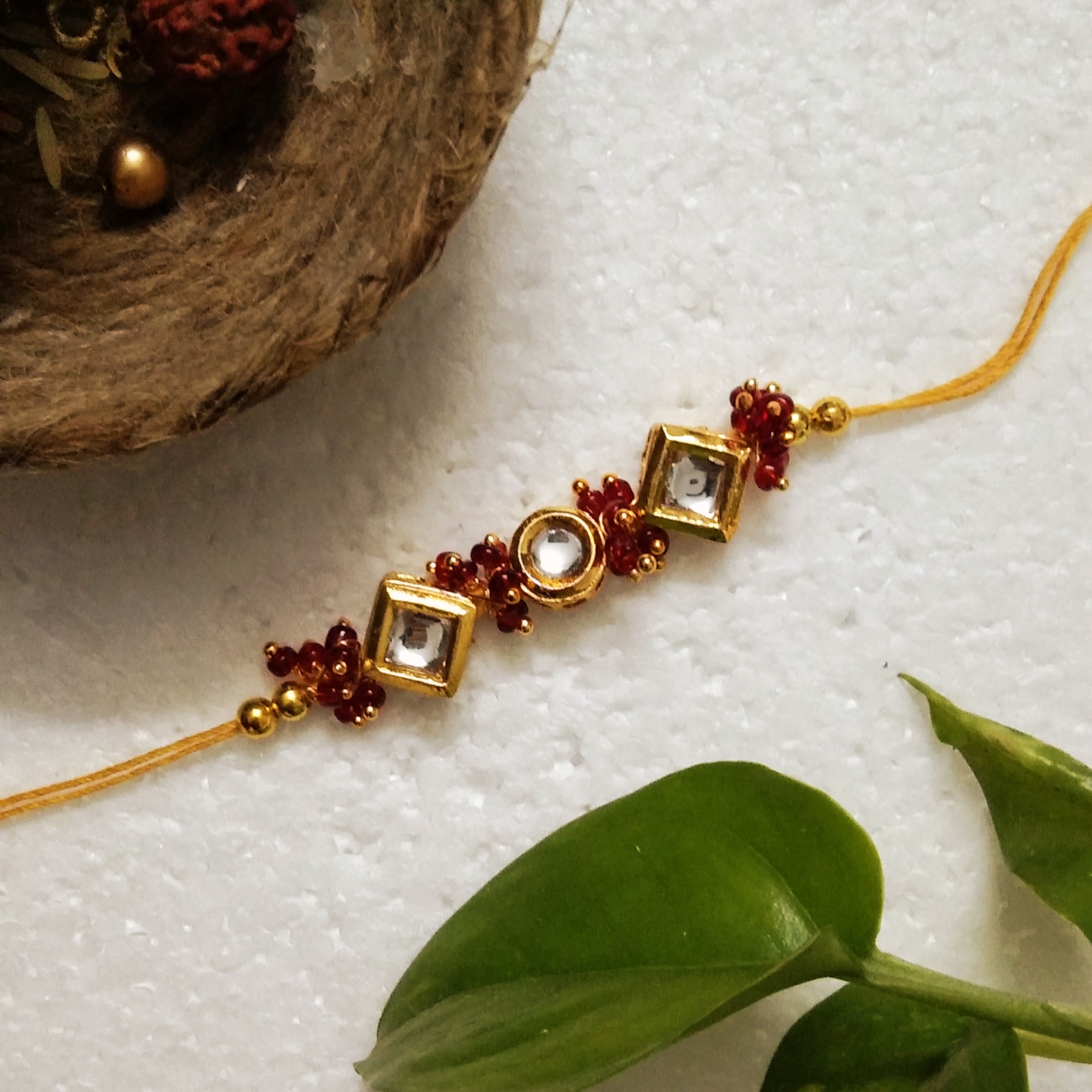 Traditional Rakhi with Wooden, Acrylic, Kundan Beads, Metal
