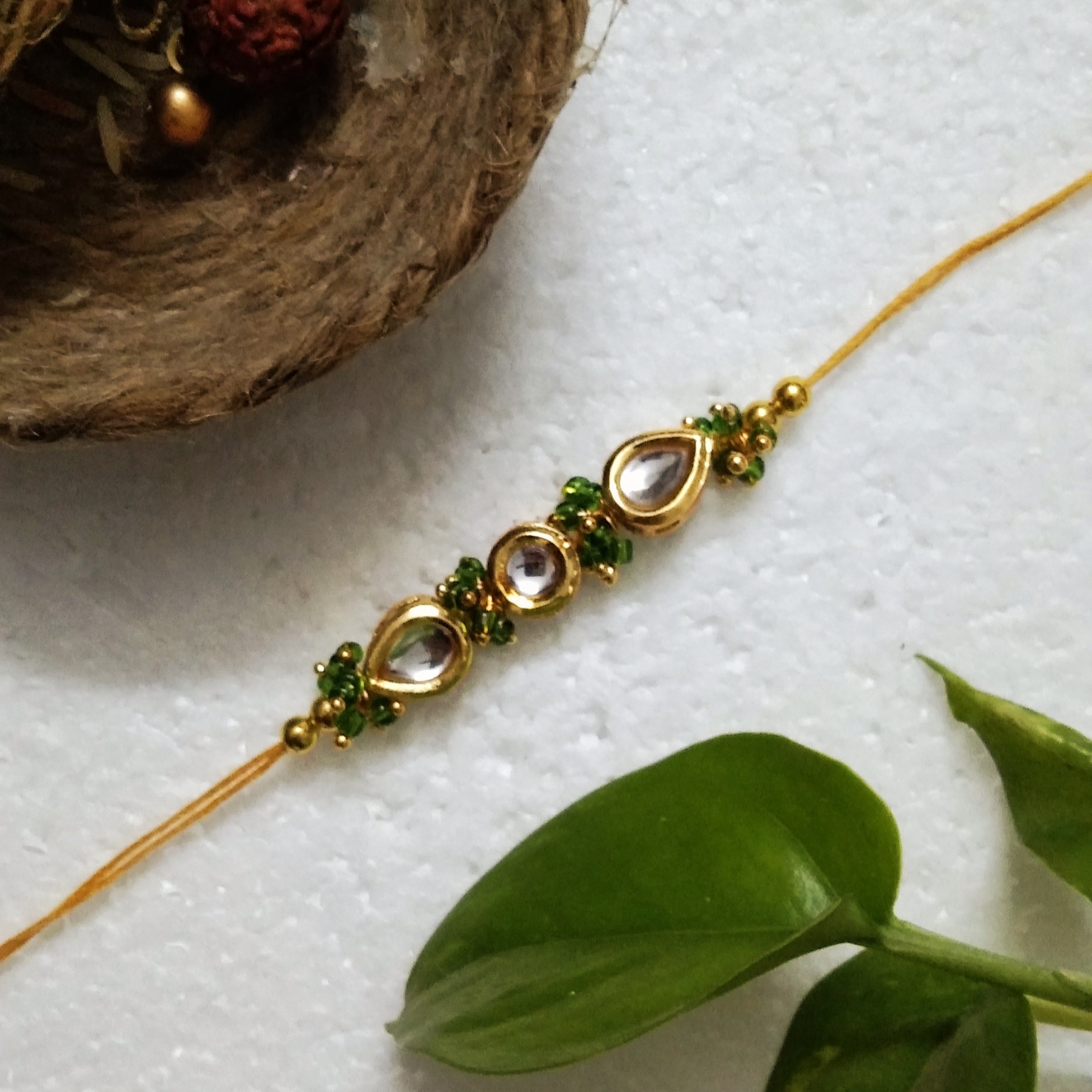 Traditional Rakhi with Metal, Kundan Beads, Acrylic, Wooden