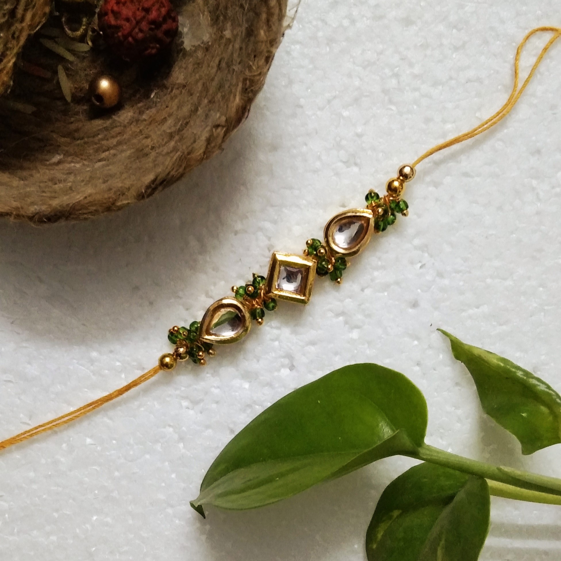 Traditional Rakhi with Metal, Acrylic, Kundan Beads, Wooden