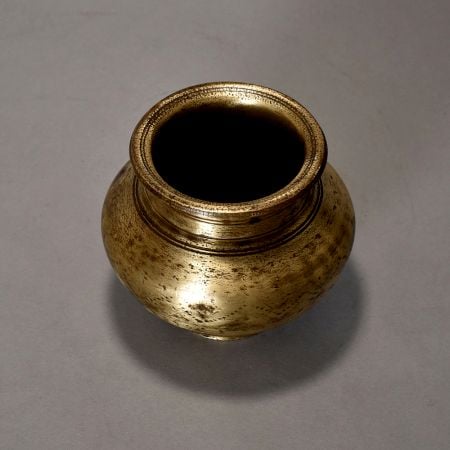 A Holy Water Pot With Dotted Design Made Of Pure Brass