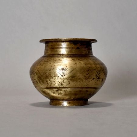 A Holy Water Pot With Dotted Design Made Of Pure Brass