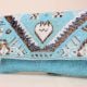 Boho Spirit Hand-Beaded Clutch with Tribal Motifs and Chain Strap